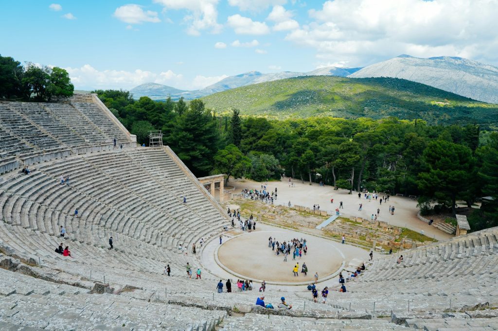 The ancient theatre at Epidaurus with forested hills behind